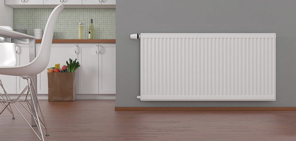 A hydronic heating radiator mounted on the wall